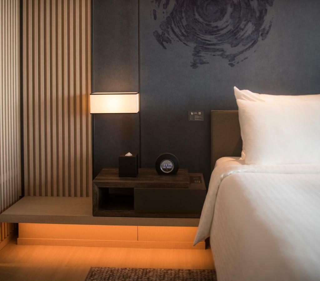 Mu Jiaoxi Hotel Екстериор снимка A room at the hotel